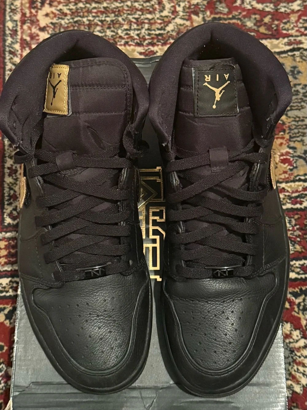 Jordan 1 Retro BHM - Men's High Top Sneakers in Black with Gold Swoosh